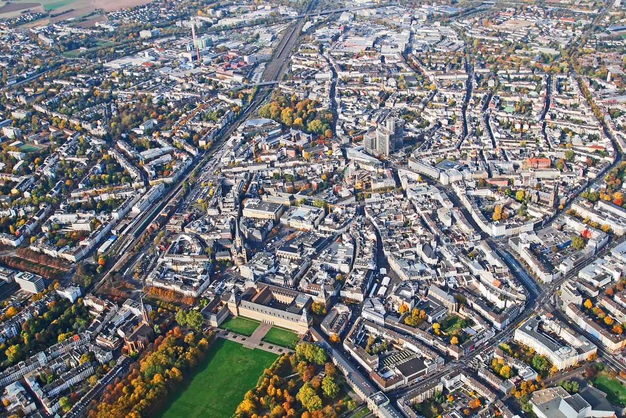 European city seen from above, dense circuit board of streets and building.